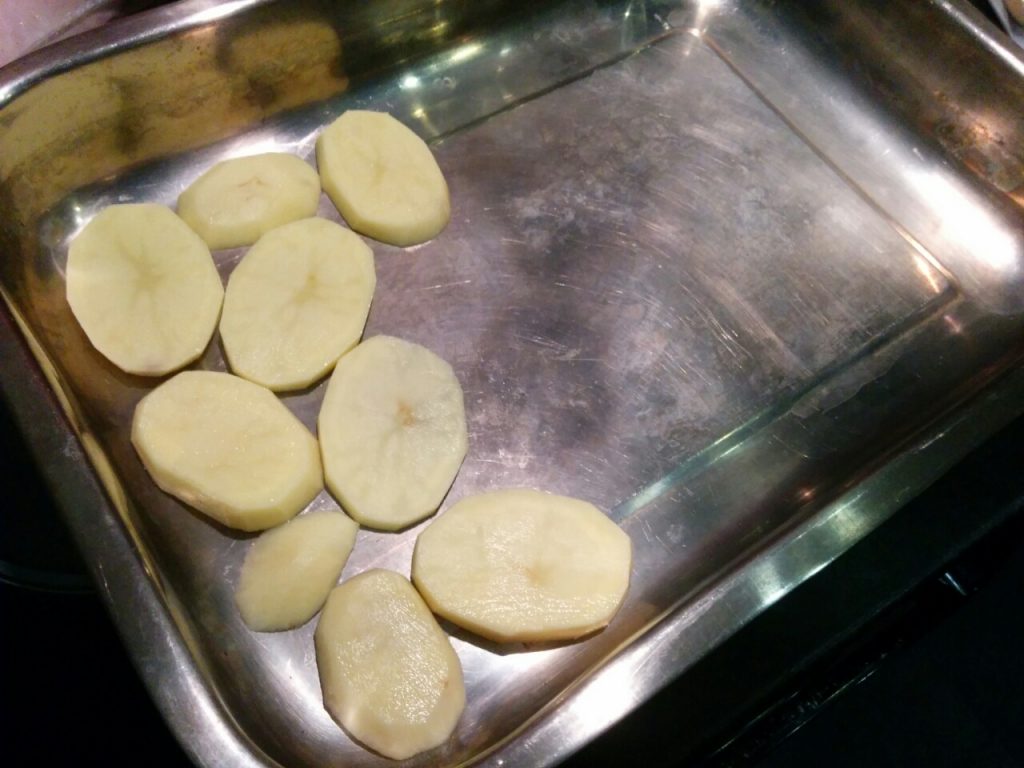 Sliced potatoes in the dish