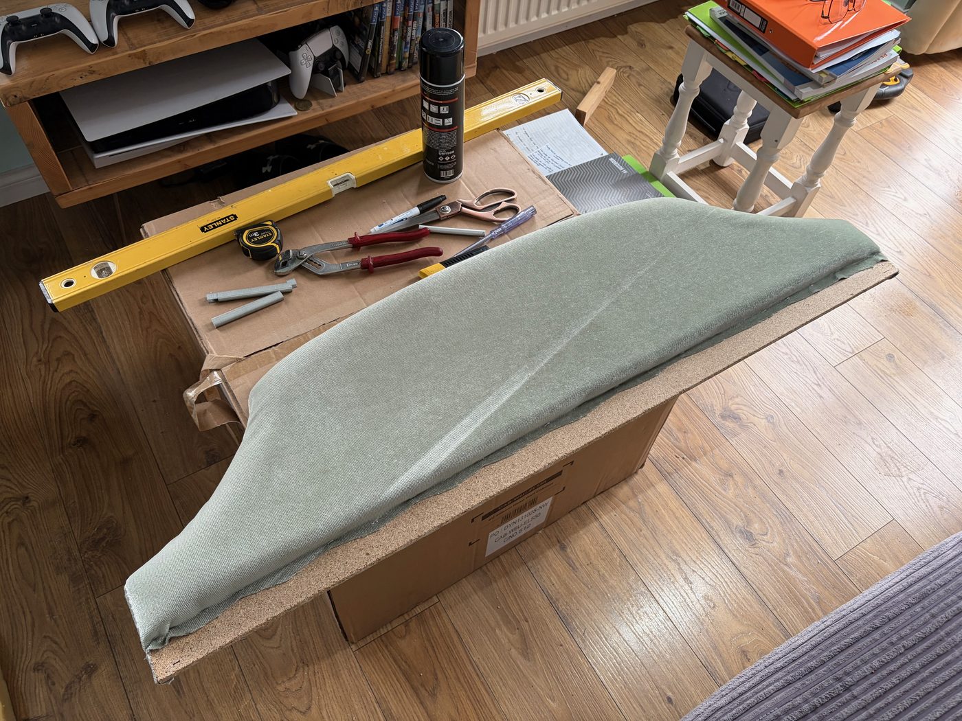 The new fabric cover fitted over the reshaped board